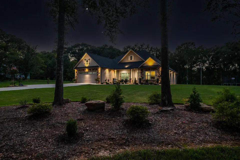 Landscaped Florida lawn and trees at dusk before summer storm season